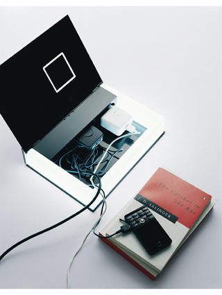 Illustration for article titled Multibook is a Lamp, Charger and Alarm Clock, Disguised As an Ordinary Book